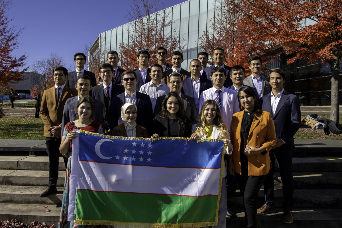 Uzbekistan students holding flag 