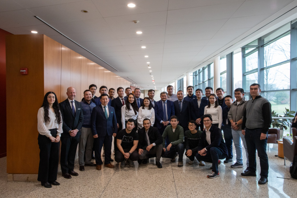 Kazakhstan delegation with Kazakh students attending Penn State in Katz lobby.