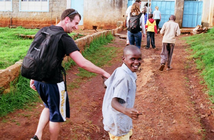 Law student Geoff Trautman '13 gets a guided tour of the Children and Youth Empowerment Compound outside Nyeri, Kenya.