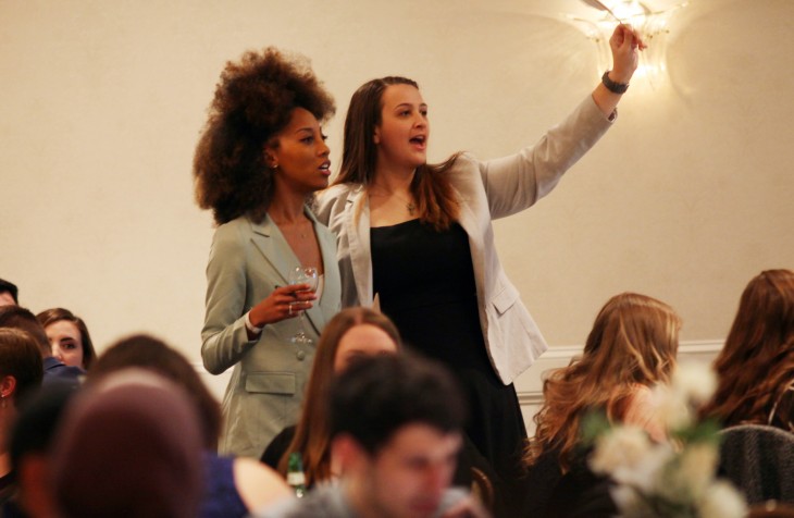 Two students at an auction event