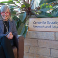 Lisa Witzig next to Center for Security Research and Education